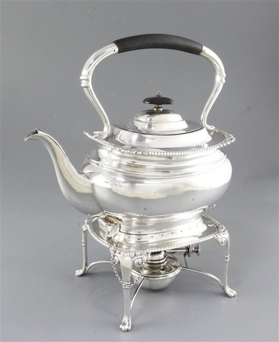 A silver kettle on stand, Height 12 ½”/318mm Width 10”/254mm., Weight 50oz/1418grms.